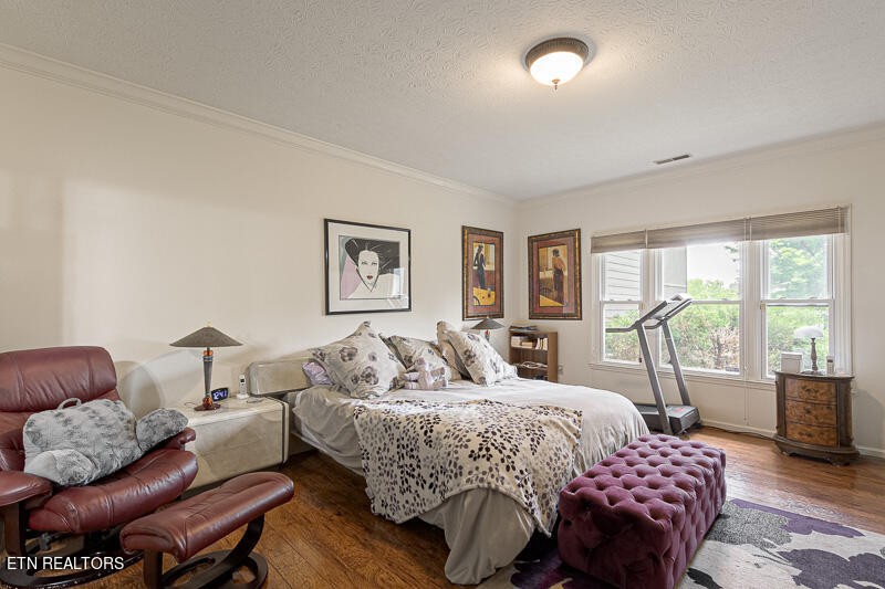 12 Rivers Court Oak Ridge, TN 37830 - Photo 15 of 25 a bedroom with a bed and wooden floor