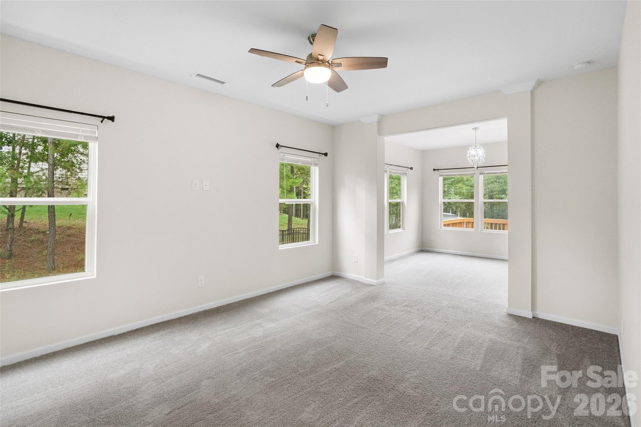 5299 Admirals Landing Lancaster, SC 29720 - Photo 11 of 39 an empty room with windows and ceiling fan