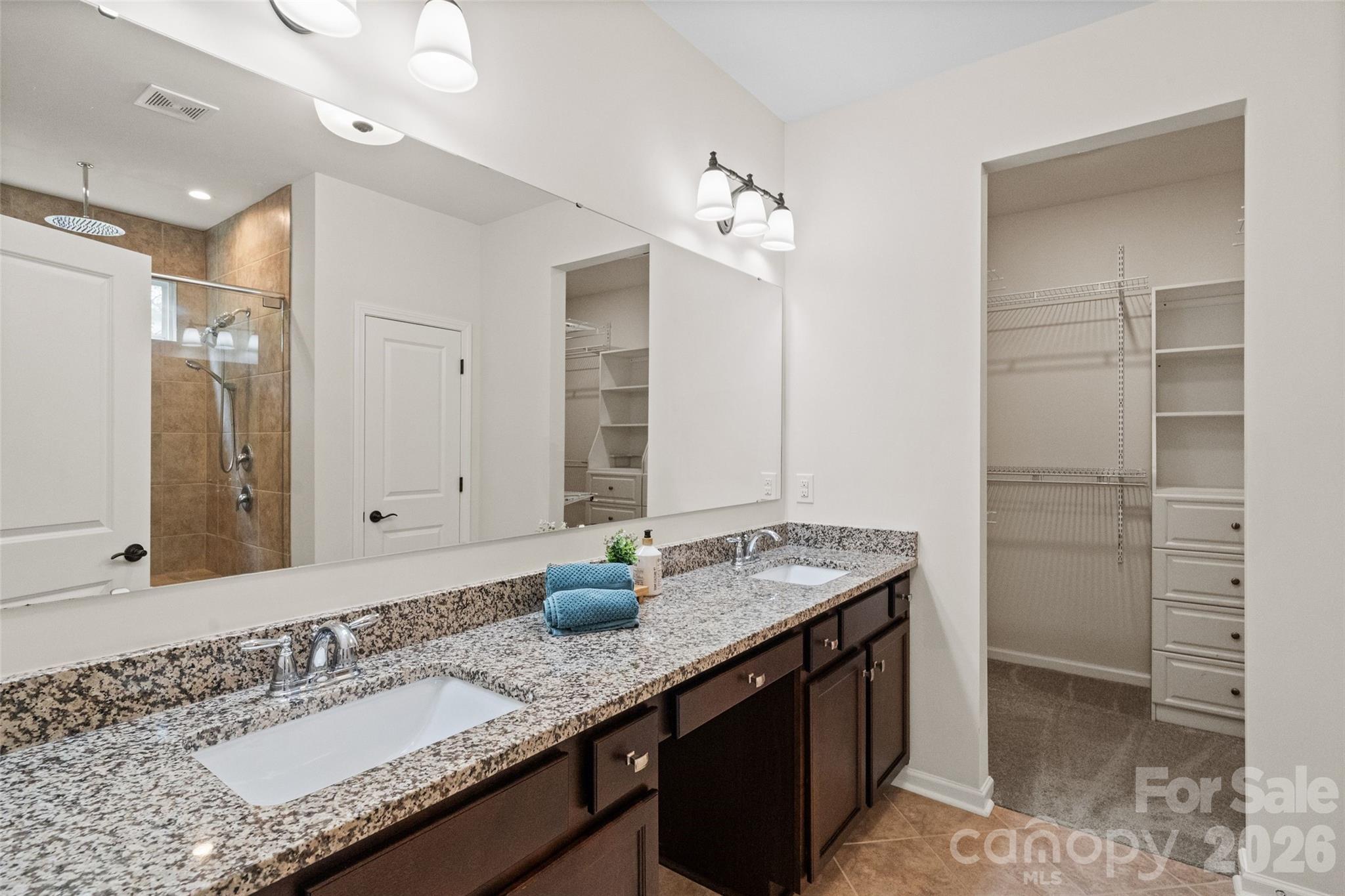 5299 Admirals Landing Lancaster, SC 29720 - Photo 15 of 39 a bathroom with a granite countertop sink and a mirror