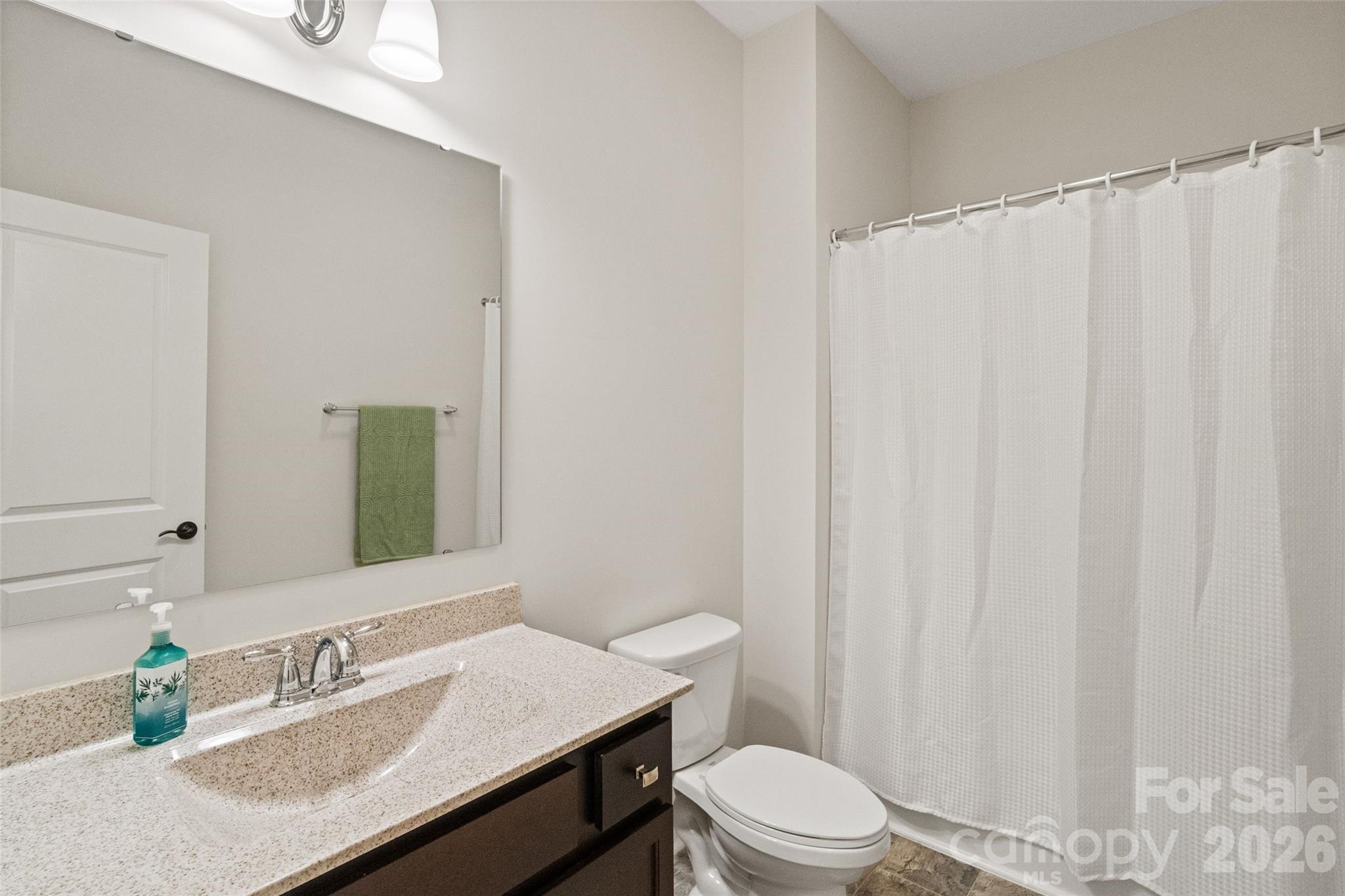 5299 Admirals Landing Lancaster, SC 29720 - Photo 18 of 39 a bathroom with a toilet a sink and curtain