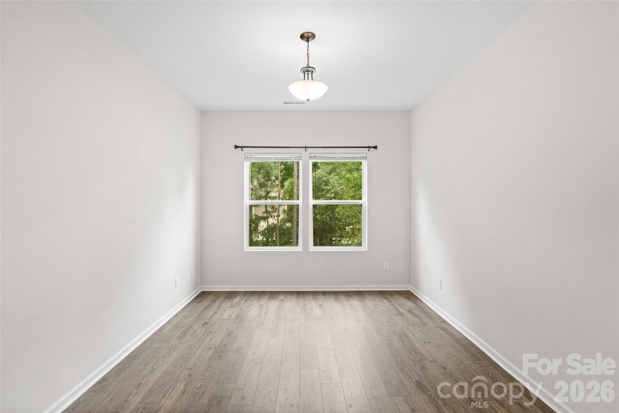 5299 Admirals Landing Lancaster, SC 29720 - Photo 19 of 39 an empty room with wooden floor and windows