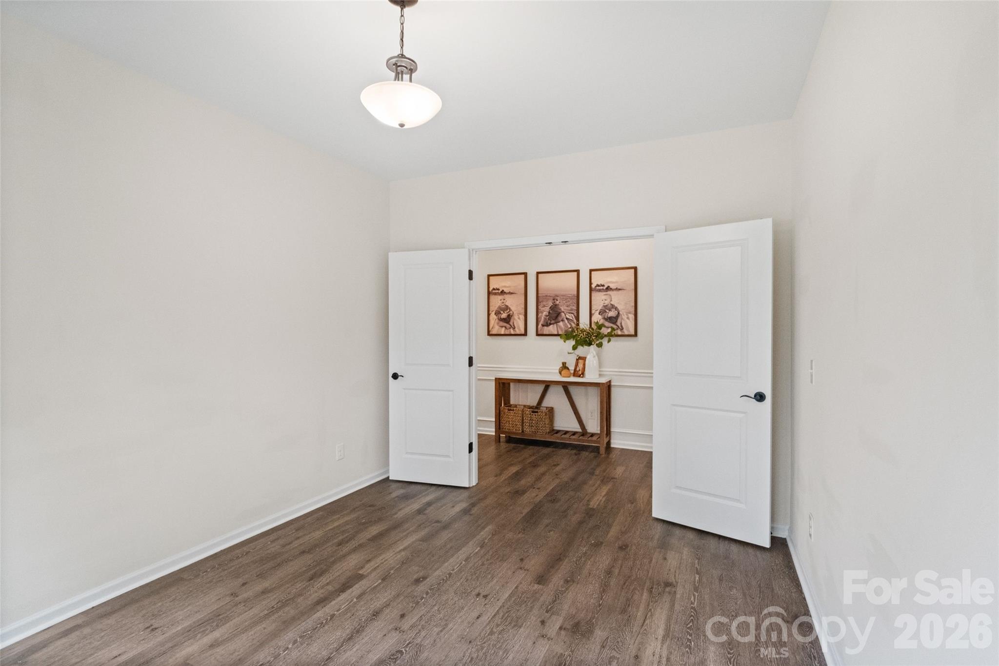 5299 Admirals Landing Lancaster, SC 29720 - Photo 20 of 39 a view of a room with wooden floor a ceiling fan and window