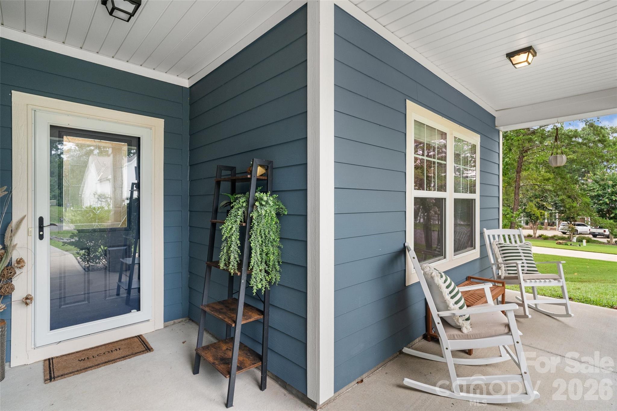5299 Admirals Landing Lancaster, SC 29720 - Photo 2 of 39 a balcony with chairs and glass door