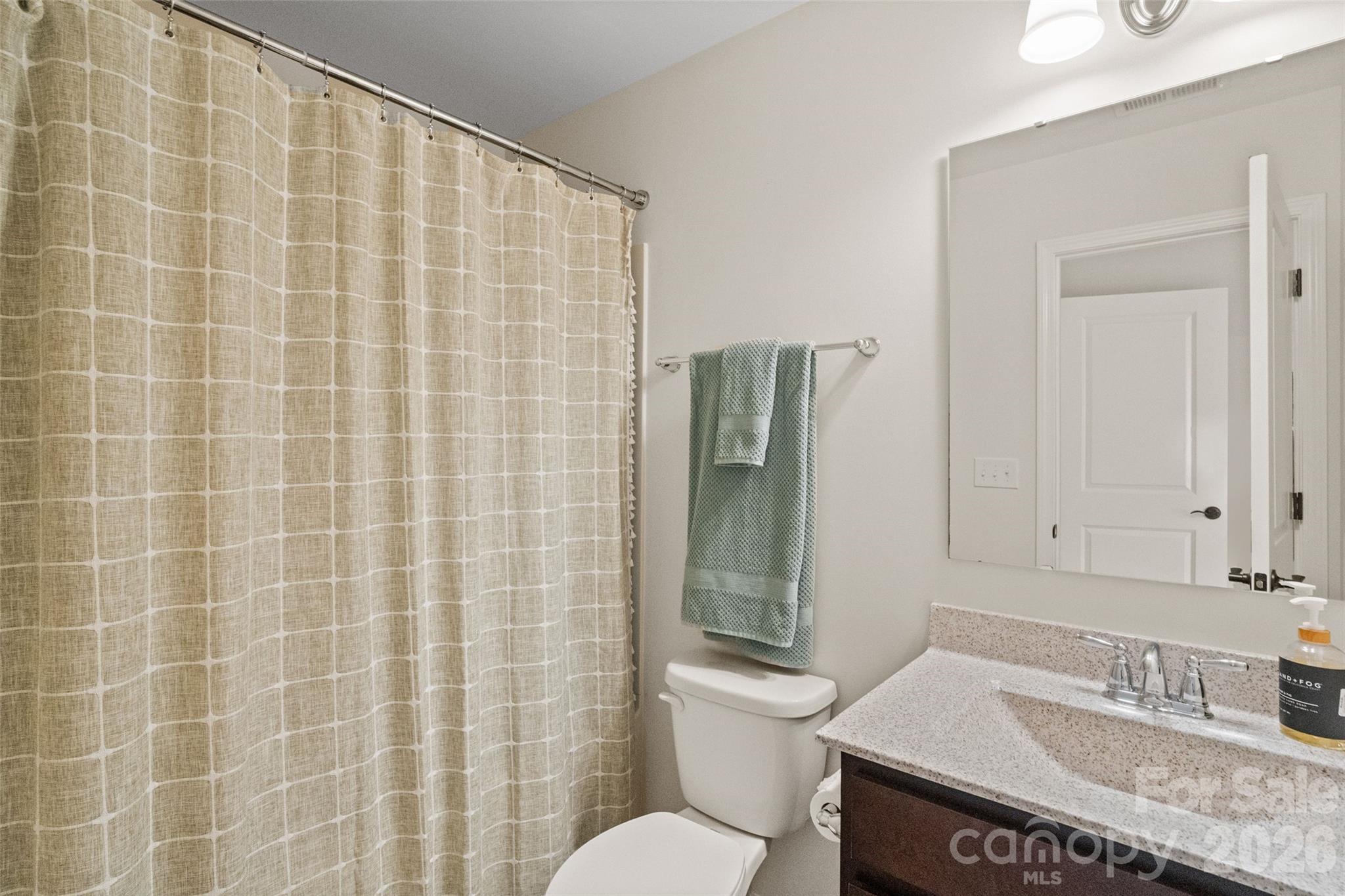 5299 Admirals Landing Lancaster, SC 29720 - Photo 23 of 39 a bathroom with a granite countertop sink toilet and shower