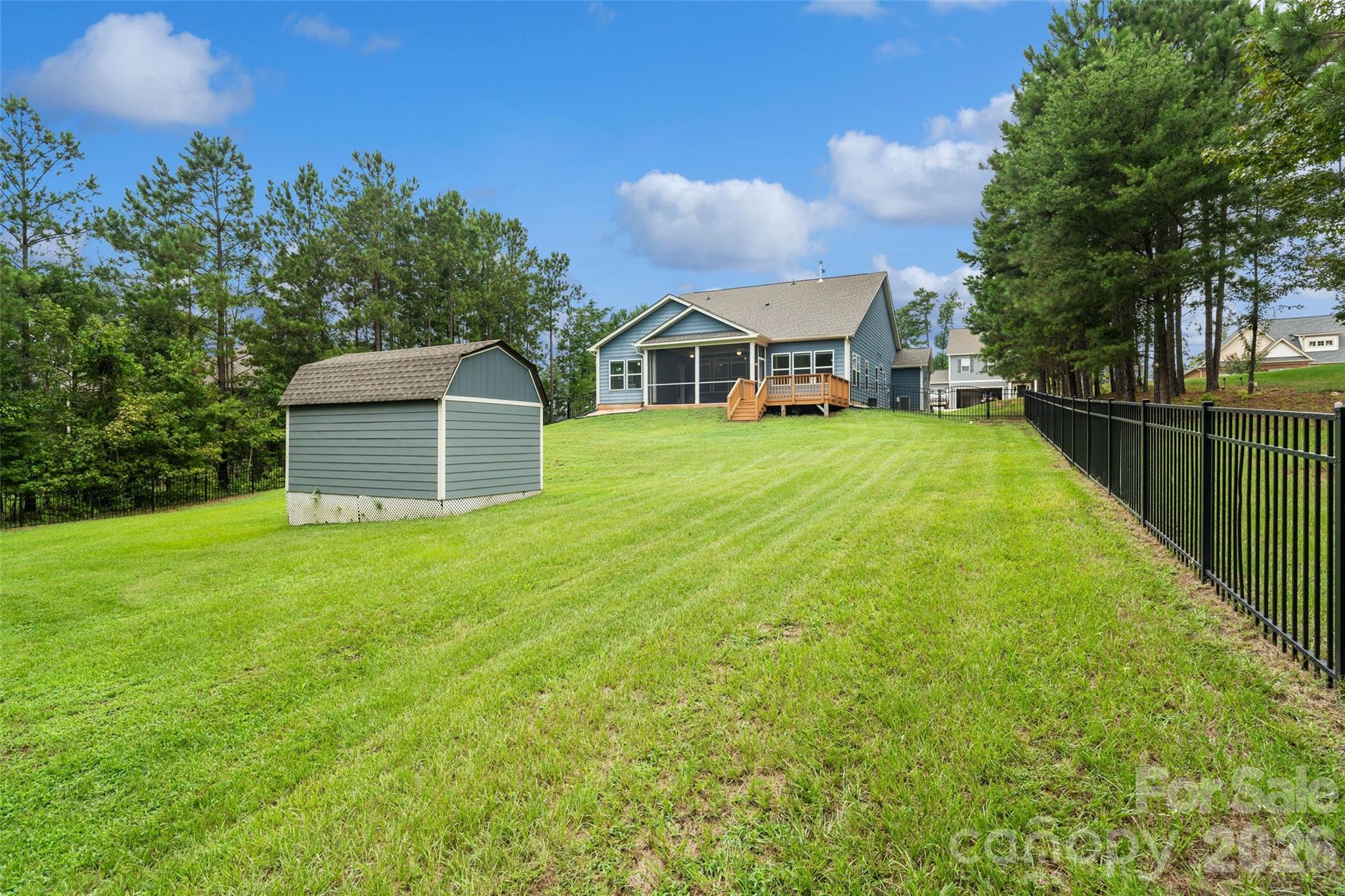 5299 Admirals Landing Lancaster, SC 29720 - Photo 29 of 39 a front view of a house with a garden and yard