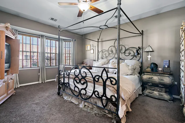 a bedroom with furniture and a window