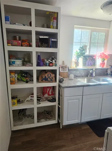 a kitchen with an oven a cabinets and a window