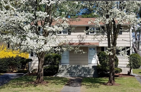 17 George Road, Unit 17 Winchester, MA 01890 - Photo 1 of 19 a view of a house with a yard