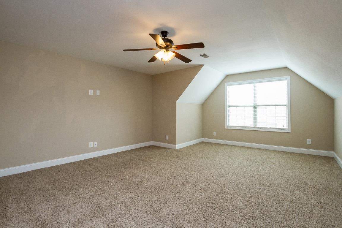 3801 Suiter Road Clarksville, TN 37040 - Photo 11 of 24 an empty room with windows and fan