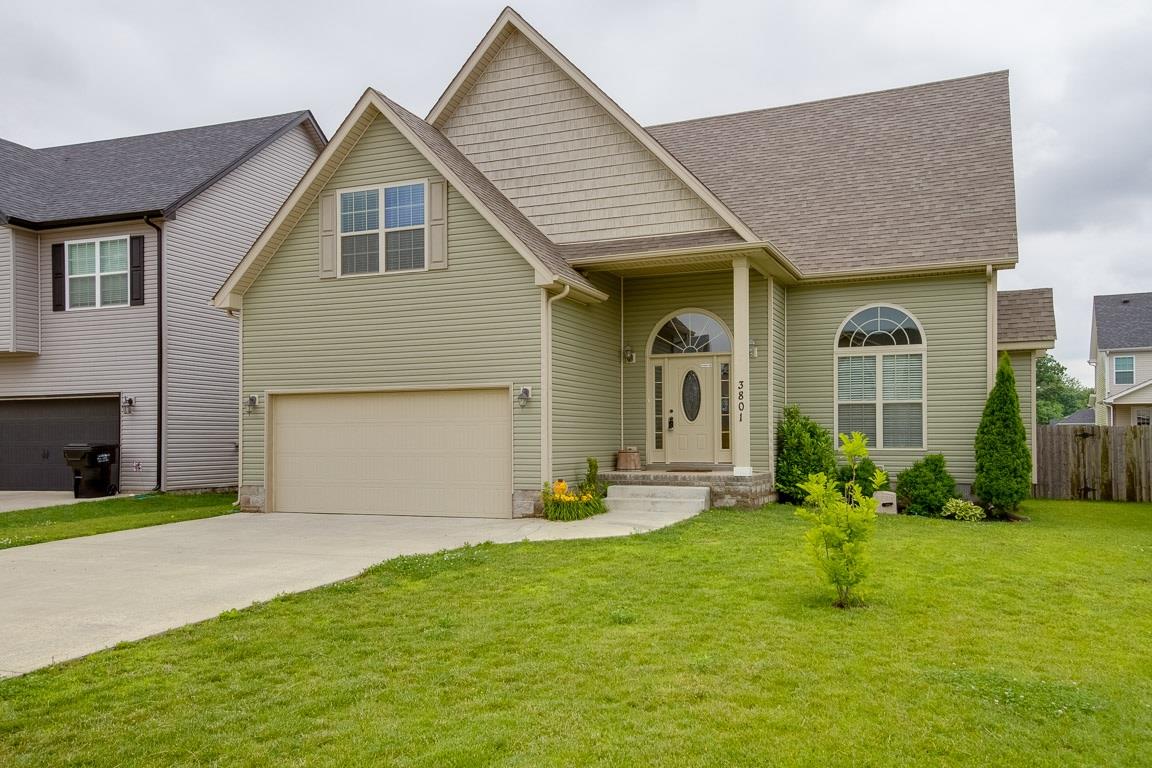 3801 Suiter Road Clarksville, TN 37040 - Photo 3 of 24 a front view of a house with a yard and garage