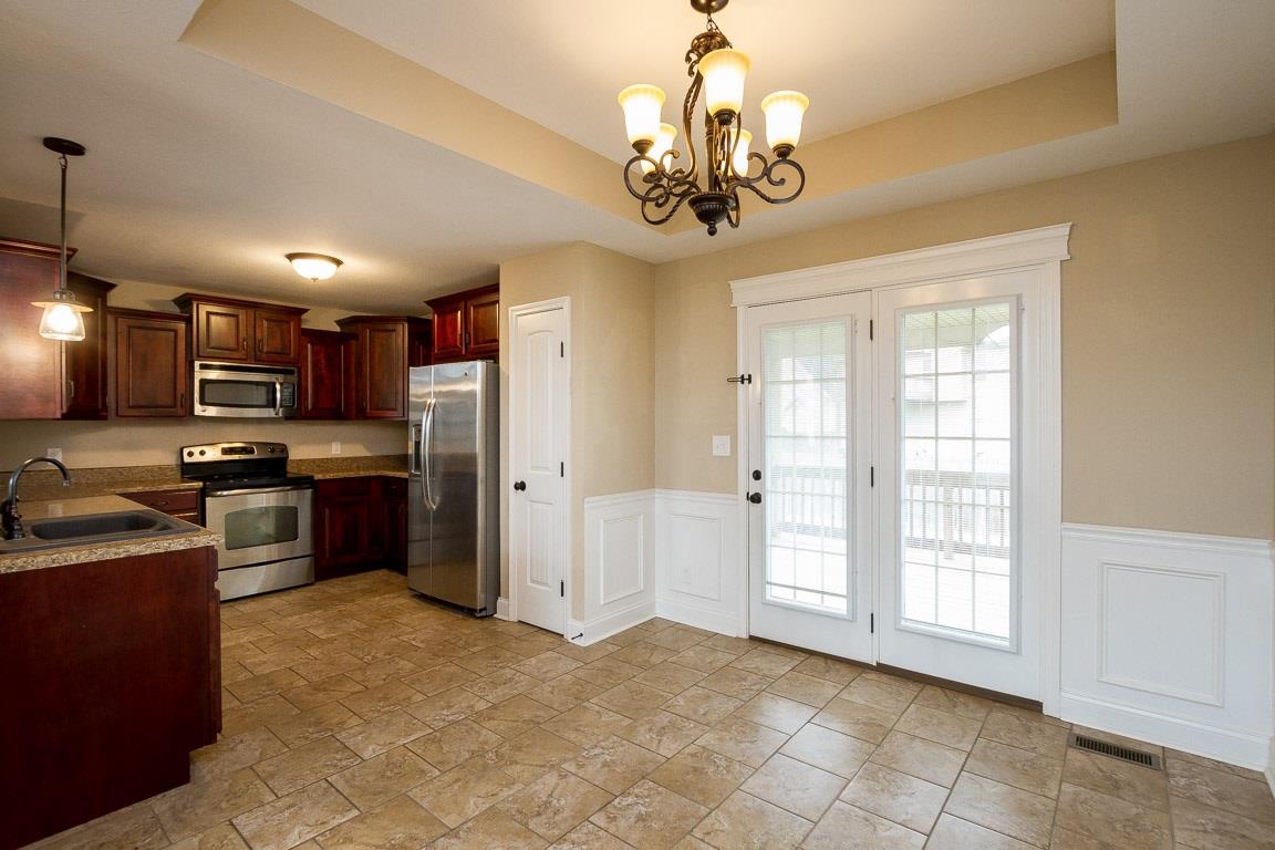 3801 Suiter Road Clarksville, TN 37040 - Photo 8 of 24 a view of kitchen with refrigerator cabinets and furniture