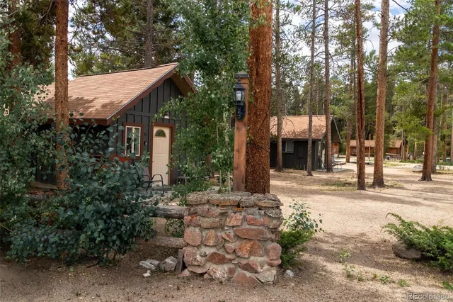 a view of a house with a tree in front