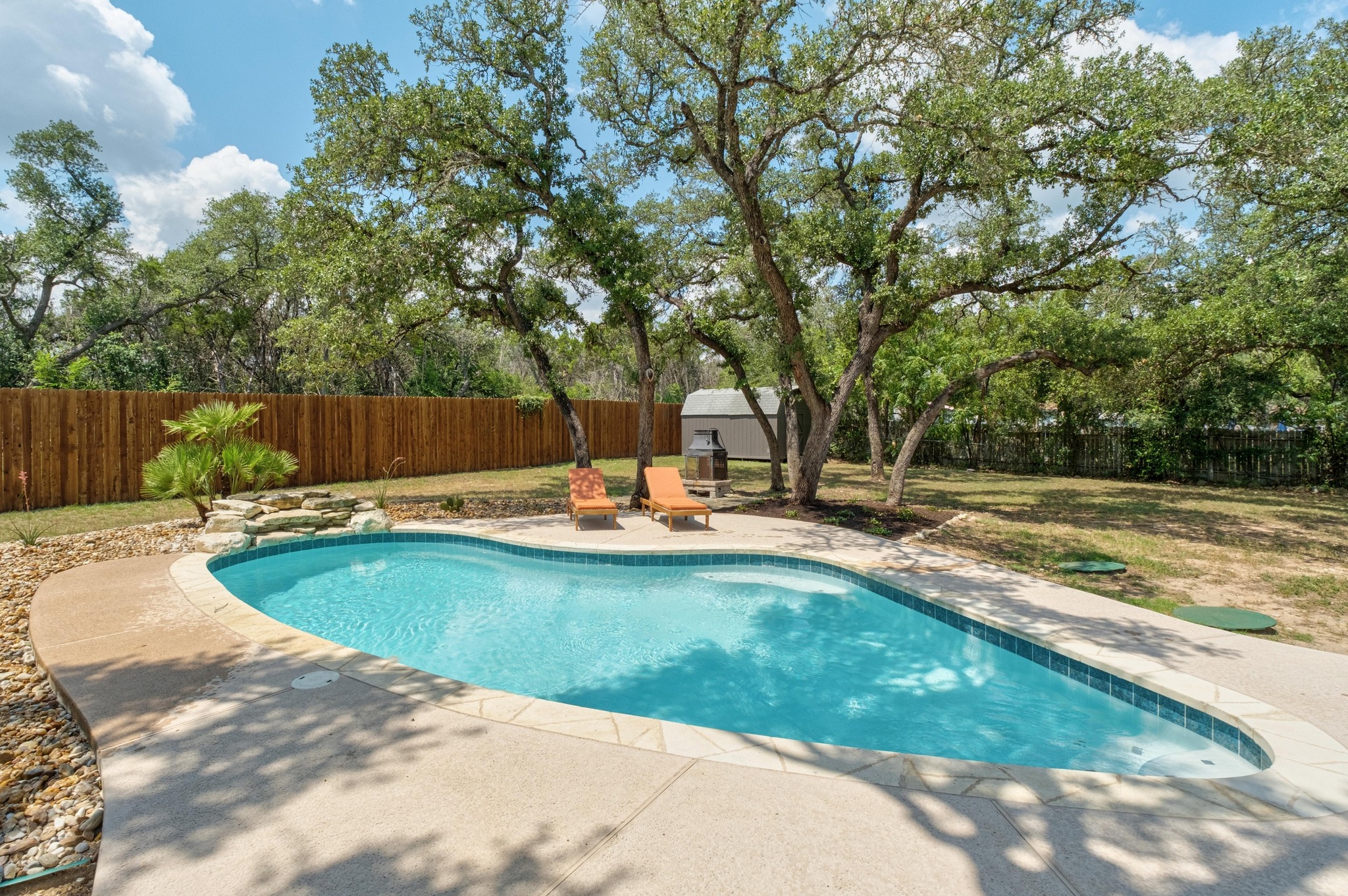 8655 Thunderbird Road Austin, TX 78736 - Photo 1 of 1 View of pool with a fenced backyard, a patio, and a storage unit