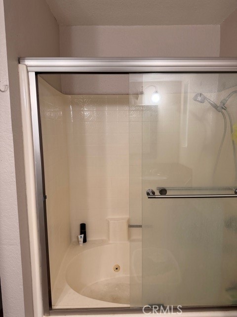 24410 Rimview Road Moreno Valley, CA 92557 - Photo 16 of 27 a bathroom with a shower and a sink