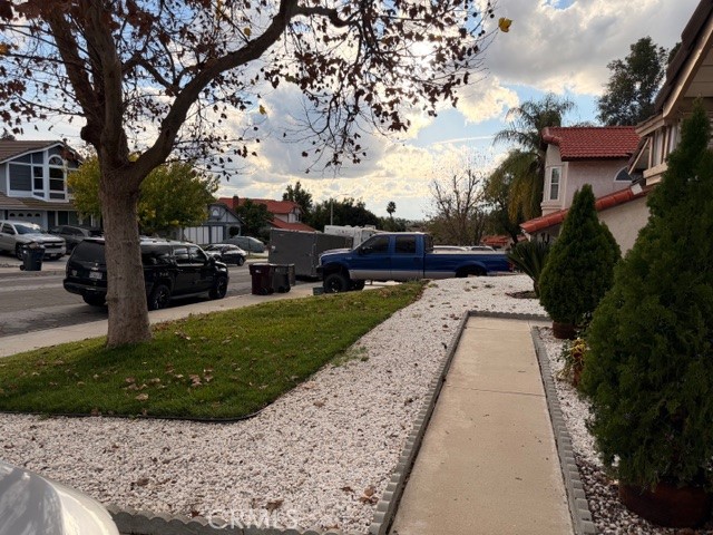 24410 Rimview Road Moreno Valley, CA 92557 - Photo 2 of 27 a view of a garden with a bench in a garden
