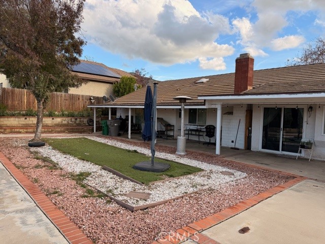 24410 Rimview Road Moreno Valley, CA 92557 - Photo 22 of 27 a front view of a house with garden