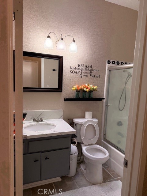 24410 Rimview Road Moreno Valley, CA 92557 - Photo 10 of 27 a bathroom with a toilet sink and mirror