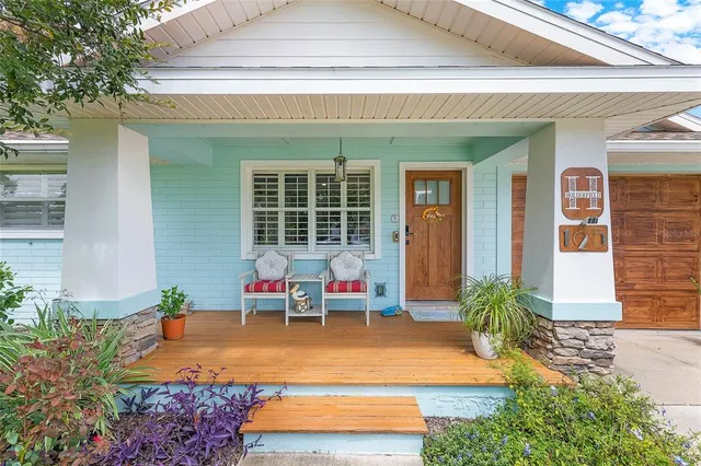 a outdoor living space with patio furniture and potted plants