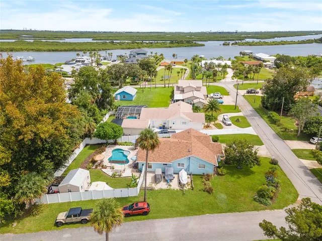an aerial view of residential houses with outdoor space