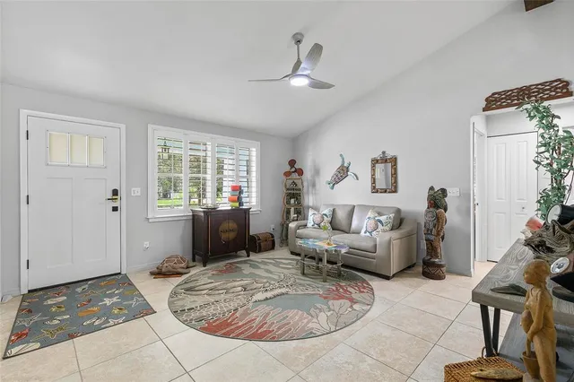 a kitchen with white cabinets and appliances
