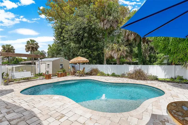 a view of a swimming pool with a patio