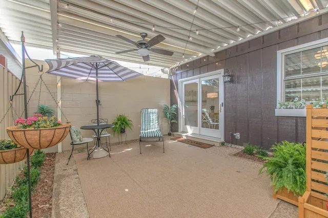 a balcony with furniture and potted plants