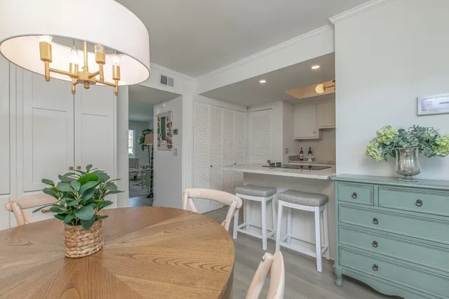 a kitchen with a table and chairs in it