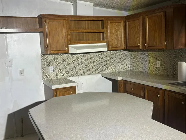 a kitchen with stainless steel appliances a refrigerator and a sink