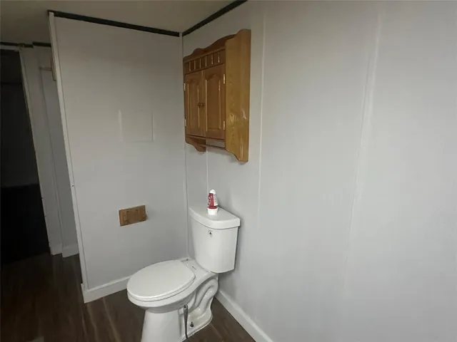 a bathroom with a toilet and a sink
