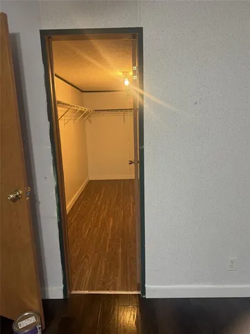 a door view with wooden floor