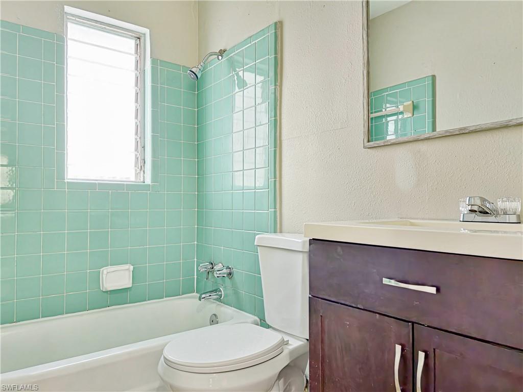 3488 Roberts Street Mims, FL 32754 - Photo 12 of 15 a bathroom with a sink a toilet and shower