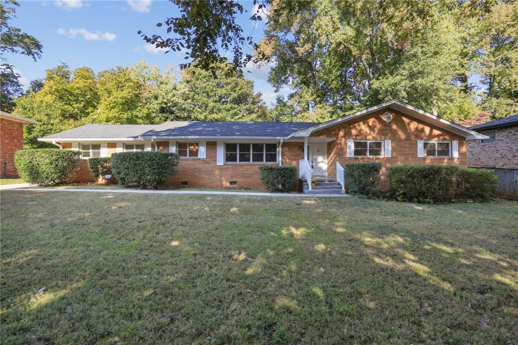 1143 Bromley Road Avondale Estates, GA 30002 - Photo 1 of 1 a front view of a house with a garden