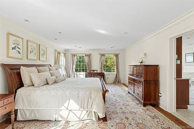 a bed room with a bed and dresser