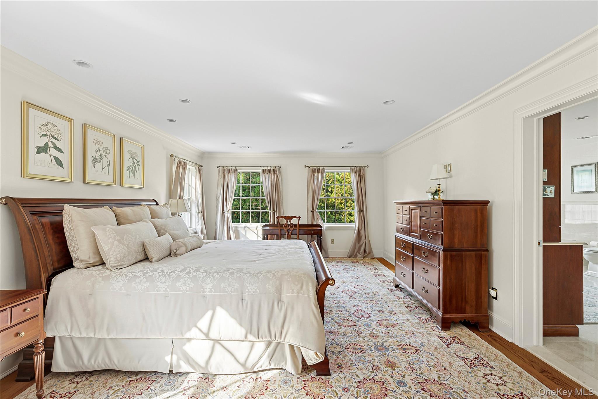 1270 Plandome Road Manhasset, NY 11030 - Photo 11 of 23 a bed room with a bed and dresser