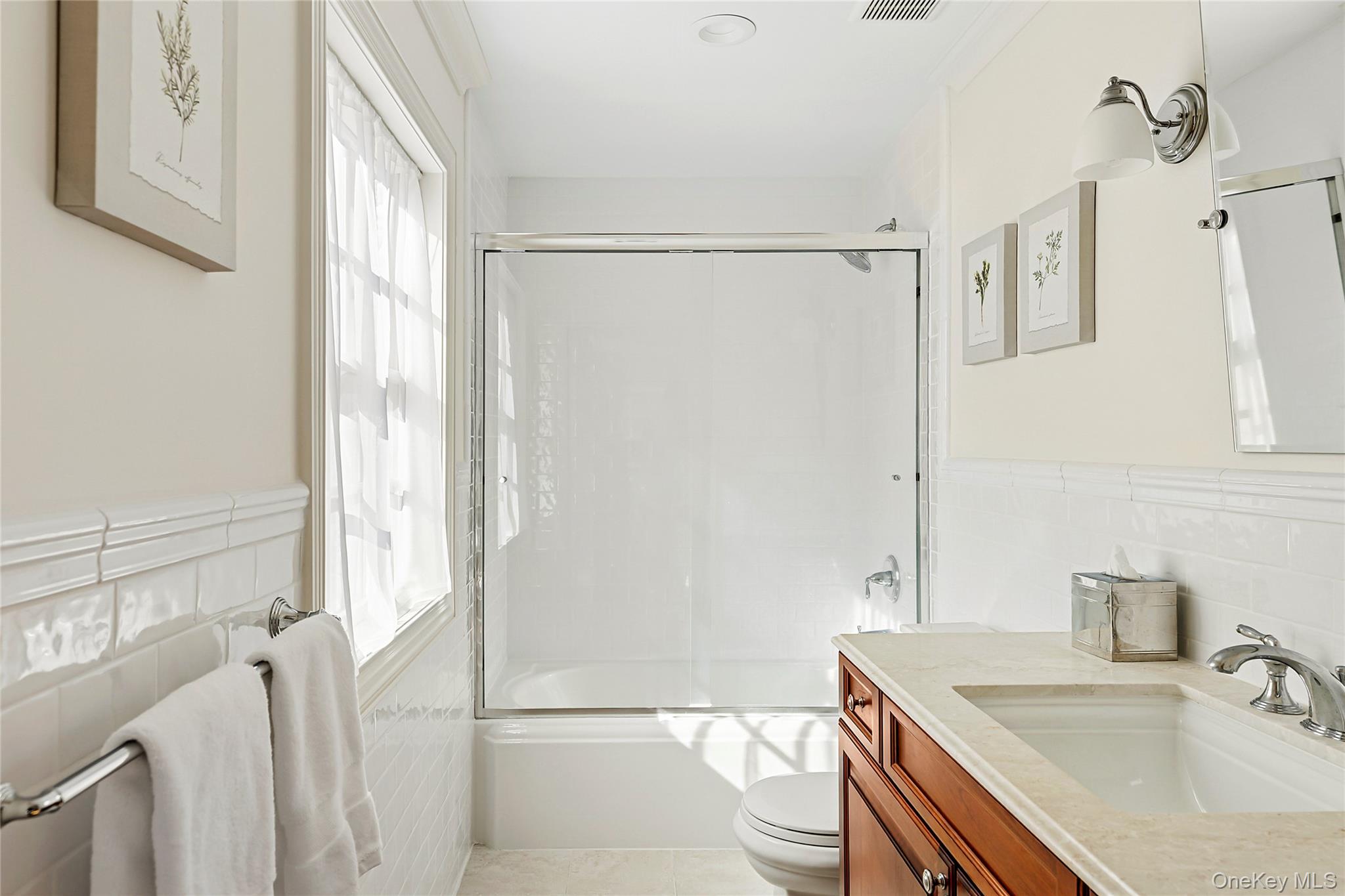 1270 Plandome Road Manhasset, NY 11030 - Photo 14 of 23 a bathroom with a sink toilet and shower