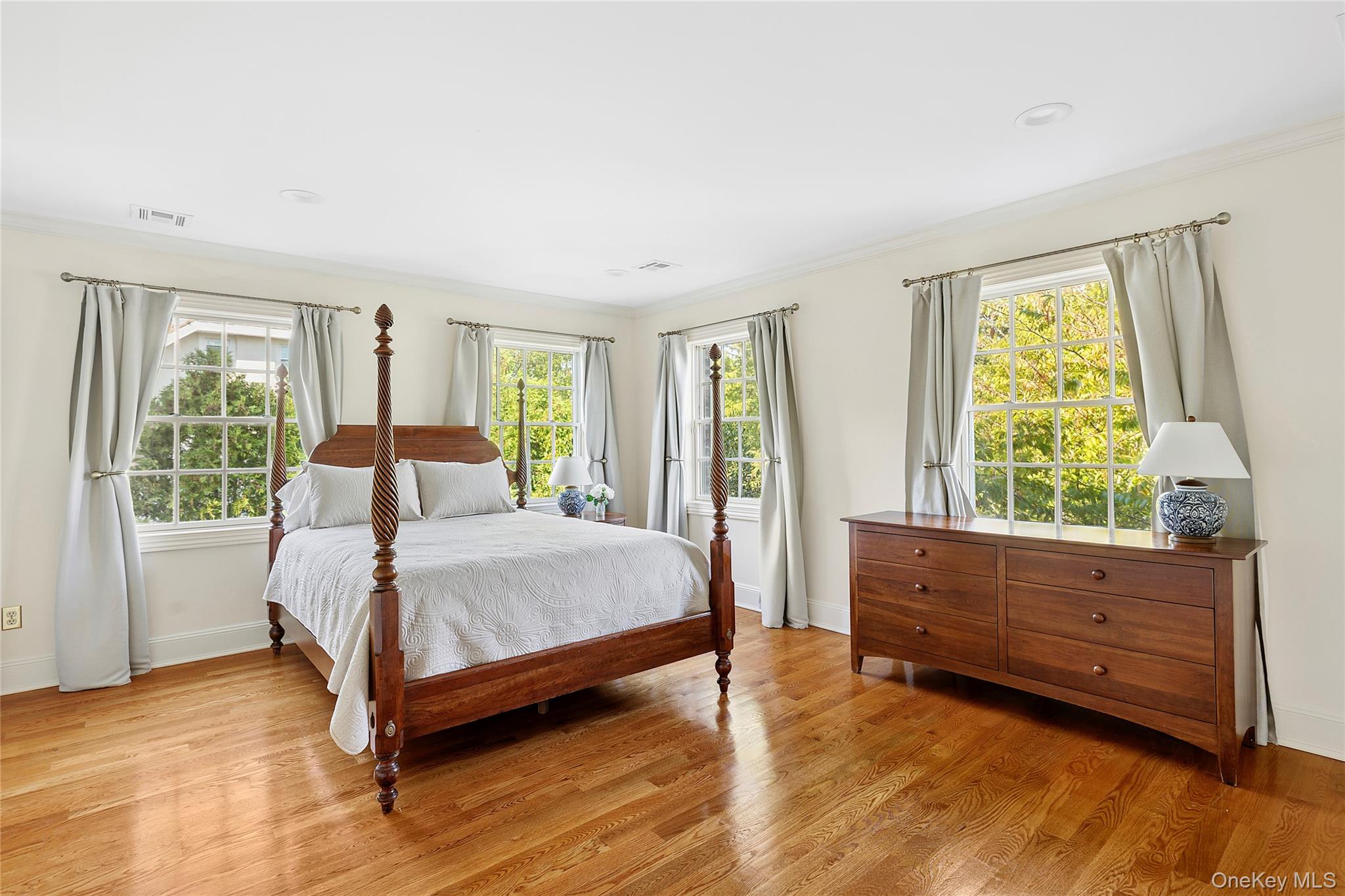 1270 Plandome Road Manhasset, NY 11030 - Photo 18 of 23 a bed room with a bed and a window
