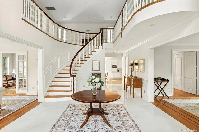 a view of entryway dining room and hall with wooden floor