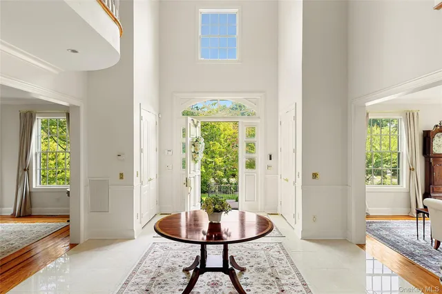 a living room with a window and a table
