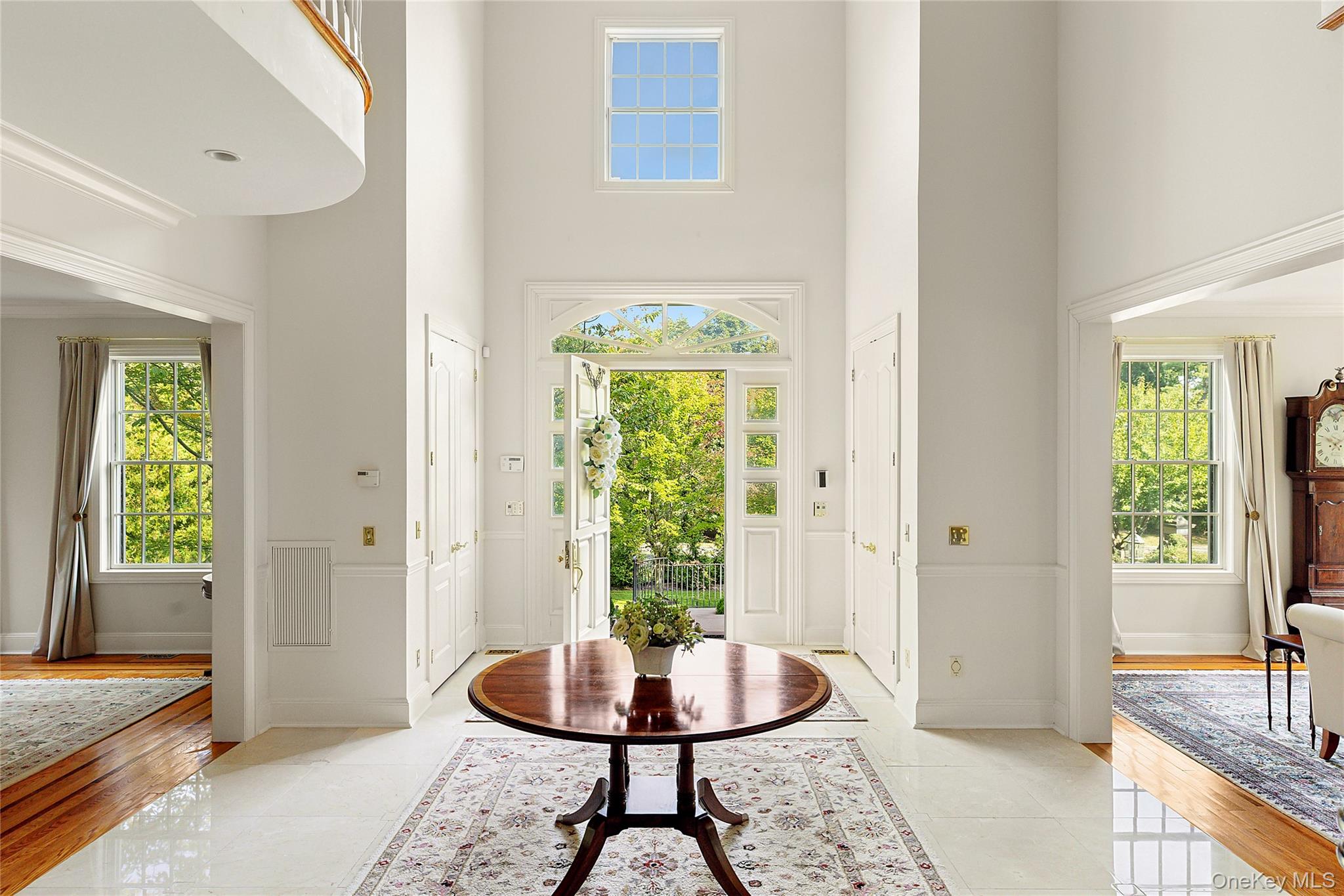 1270 Plandome Road Manhasset, NY 11030 - Photo 4 of 23 a living room with a window and a table