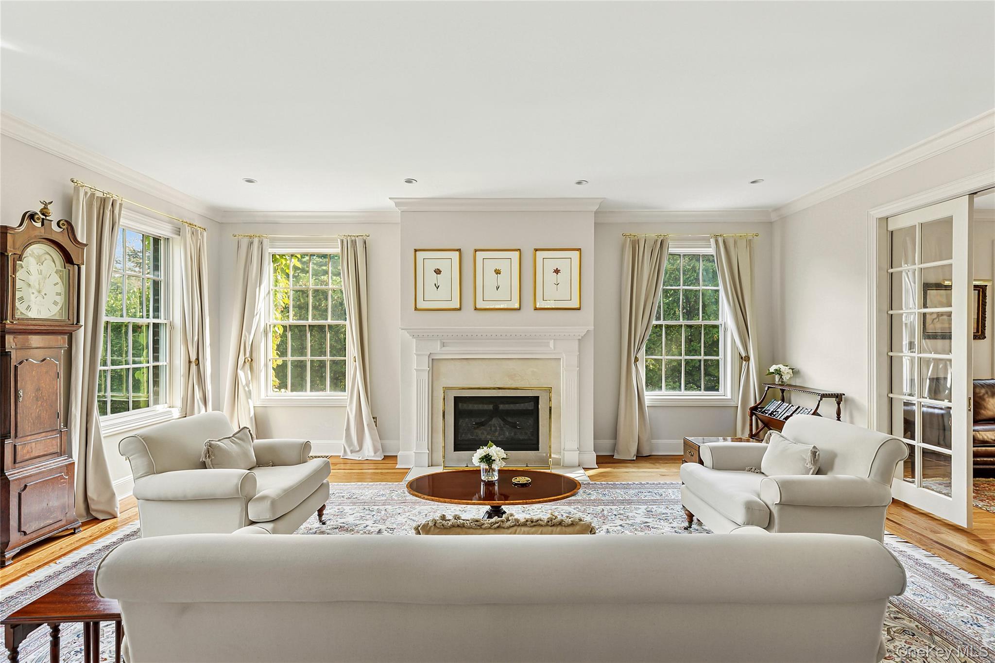 1270 Plandome Road Manhasset, NY 11030 - Photo 5 of 23 a living room with furniture and a fireplace