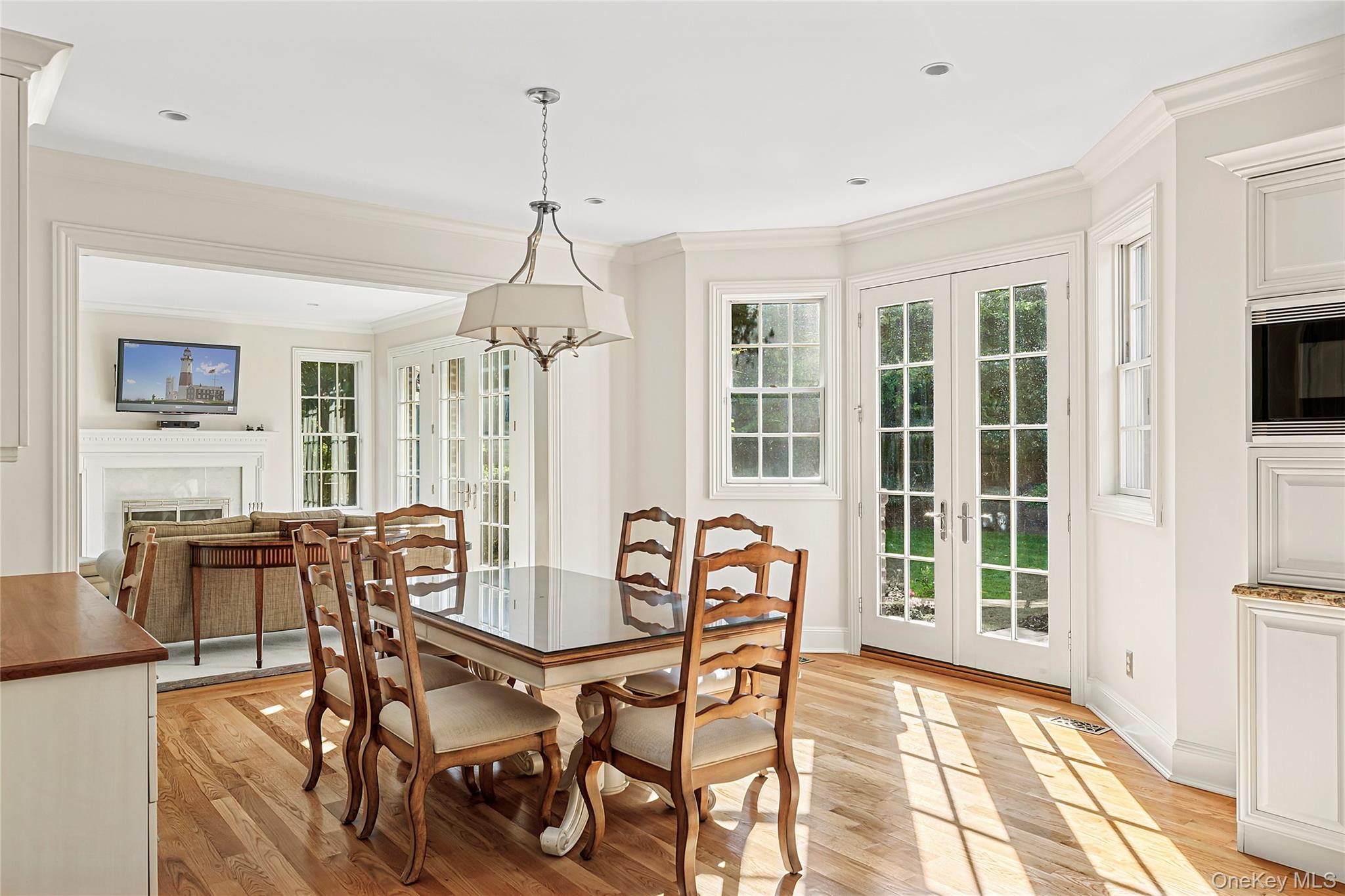 1270 Plandome Road Manhasset, NY 11030 - Photo 9 of 23 a view of a dining room with furniture and windows