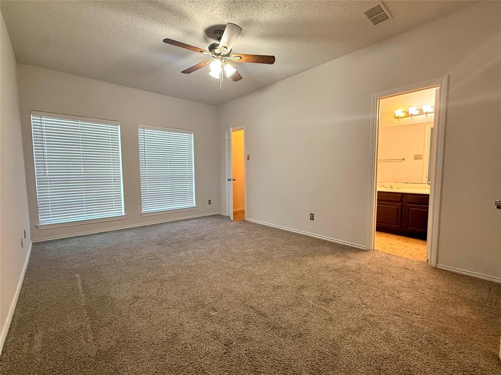 14277 Preston Road, Unit 512 Dallas, TX 75254 - Photo 3 of 8 a view of an empty room with a bathroom