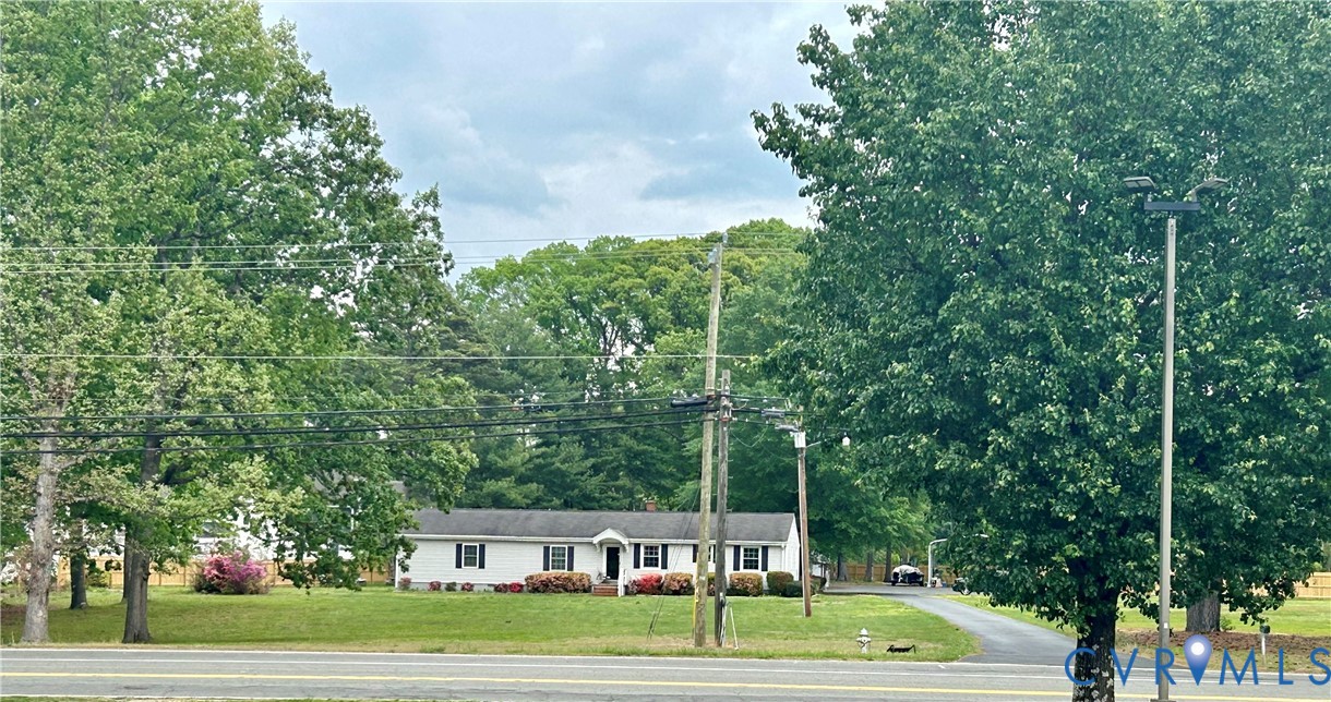 8054 Shady Grove Road Mechanicsville, VA 23111 - Photo 1 of 16 a front view of a house with a yard