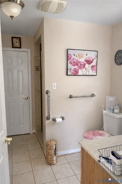 8054 Shady Grove Road Mechanicsville, VA 23111 - Photo 13 of 16 a bathroom with a granite countertop sink a toilet and a shower