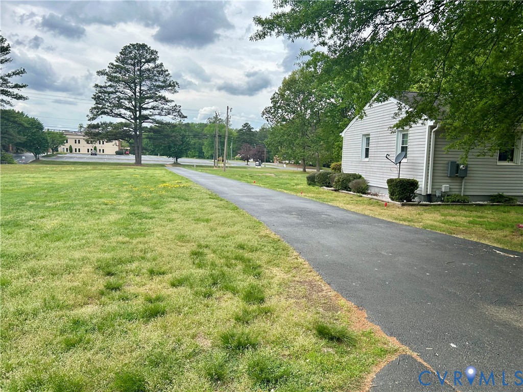 8054 Shady Grove Road Mechanicsville, VA 23111 - Photo 4 of 16 a view of a house with a yard
