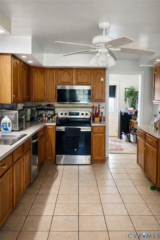 8054 Shady Grove Road Mechanicsville, VA 23111 - Photo 7 of 16 a kitchen with a stove sink and cabinets