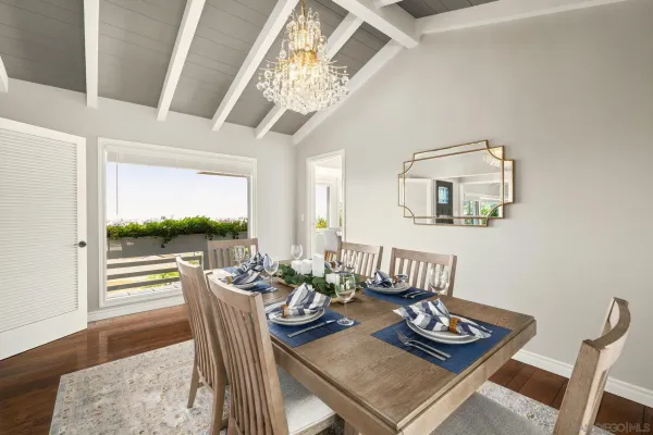 a kitchen with a table and chairs in it