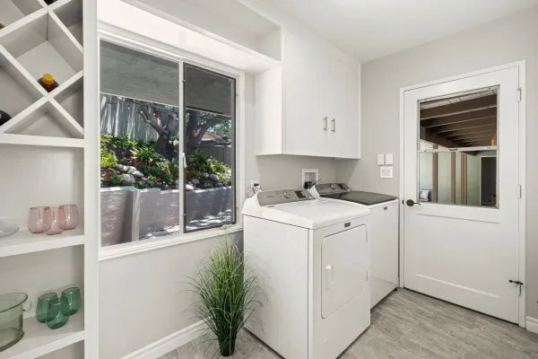 a bedroom with a bed dresser and flat screen tv