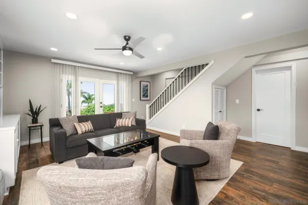 a view of a patio with swimming pool table and chairs