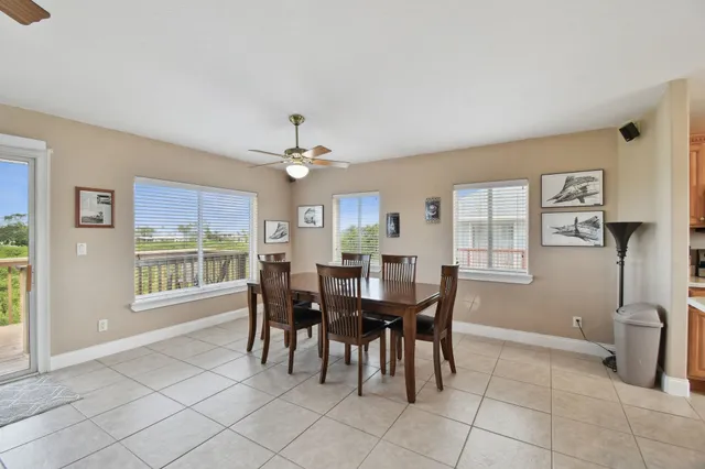 a kitchen with stainless steel appliances granite countertop a sink a stove and refrigerator